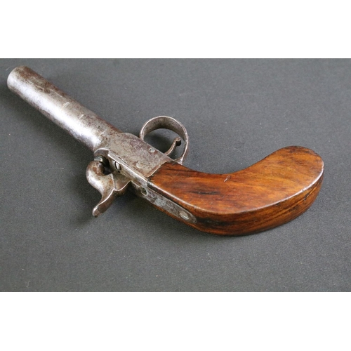 478 - A 19th Century Percussion Pistol. The pistol with a screw off barrel, fronting the mechanism engrave... 