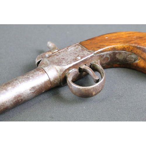 478 - A 19th Century Percussion Pistol. The pistol with a screw off barrel, fronting the mechanism engrave... 