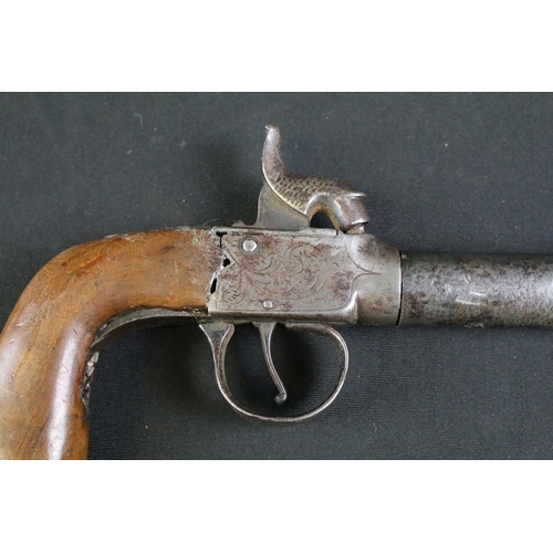 479 - A 19th Century Percussion Pistol. The mechanism engraved with scrolled floral decoration. The trigge... 