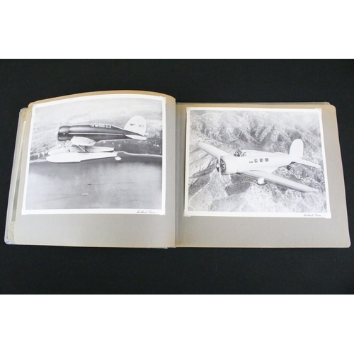 483 - A World War Two / WW2 era photograph postcard album contained original press photographs, photograph... 