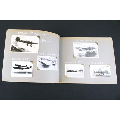 483 - A World War Two / WW2 era photograph postcard album contained original press photographs, photograph... 