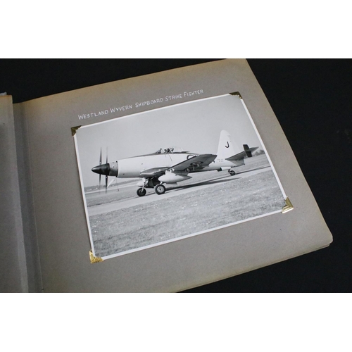 483 - A World War Two / WW2 era photograph postcard album contained original press photographs, photograph... 