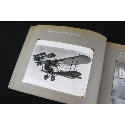 483 - A World War Two / WW2 era photograph postcard album contained original press photographs, photograph... 