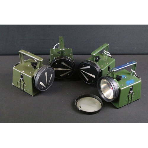 487 - A collection of four British military / NATO issued Bardic lamps, four colours lens, with arrow cove... 