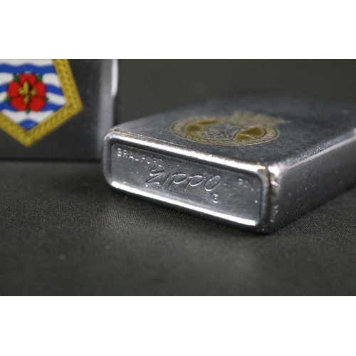 488 - A collection of three British Royal Navy souvenir Zippo lighters to include HMS Minerva, HMS Tireles... 