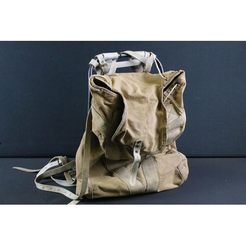 514 - A British 20th Century military canvas and webbing backpack with metal frame and leather strapworks.