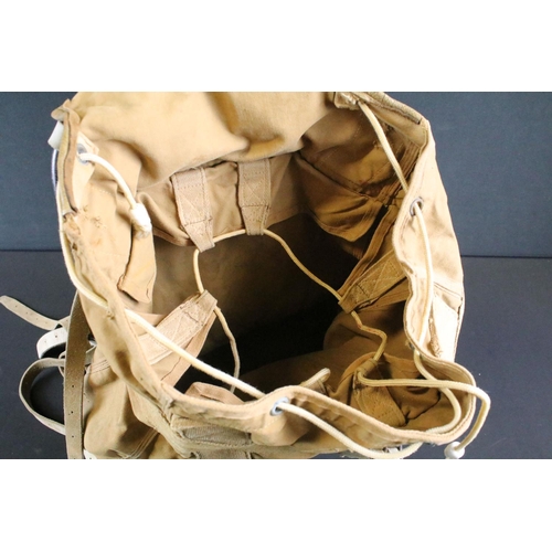 514 - A British 20th Century military canvas and webbing backpack with metal frame and leather strapworks.