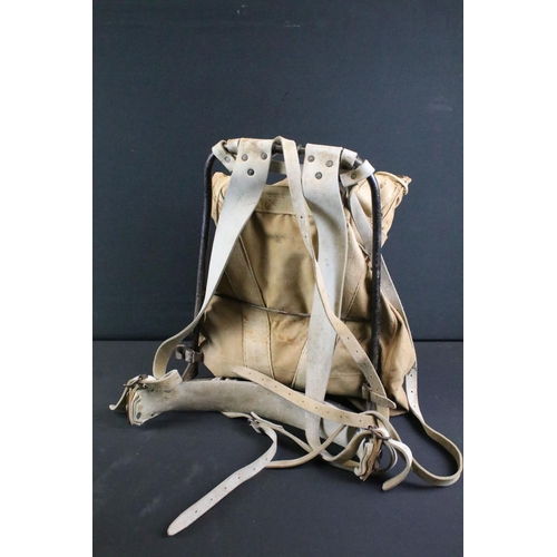 514 - A British 20th Century military canvas and webbing backpack with metal frame and leather strapworks.