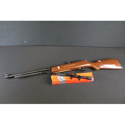 515 - A vintage Cal.177 air rifle together with boxed rifle scope.