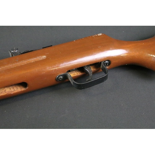 515 - A vintage Cal.177 air rifle together with boxed rifle scope.