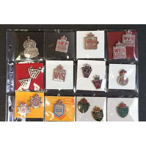 516 - A large collection of military badges to include cap badges, collar badges, military association bad... 