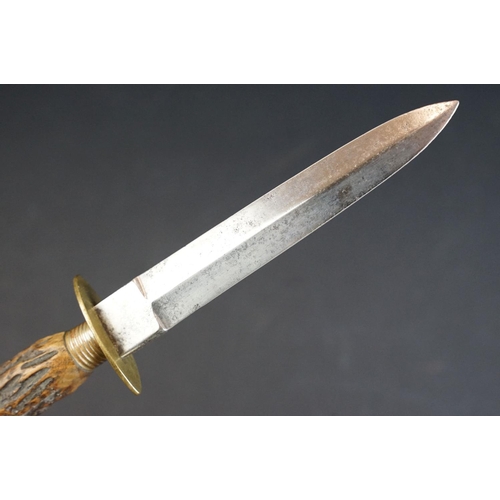 57 - A Hunting / Fighting knife by W. Singleton & Co. of Sheffield, with antler handle and leather scabba... 