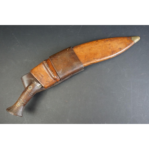 58 - A British World War Two / WW2 military issue Gurkha kukri with leather scabbard, the blade marked 41... 