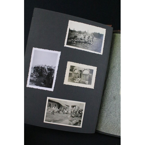 61 - A Genuine World War Two German soldiers photograph album complete with contents of seventy two photo... 