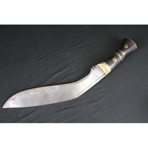 86 - A World War Two era large Kukri knife, steel blade, wooden handle with brass fixings, broad arrow ma... 