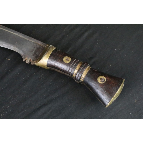 86 - A World War Two era large Kukri knife, steel blade, wooden handle with brass fixings, broad arrow ma... 