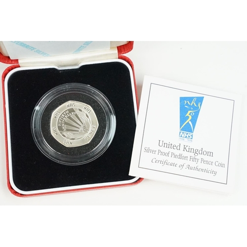 106 - A collection of four Royal Mint Queen Elizabeth II 50p silver proof coins to include 2000, 1998, 199... 