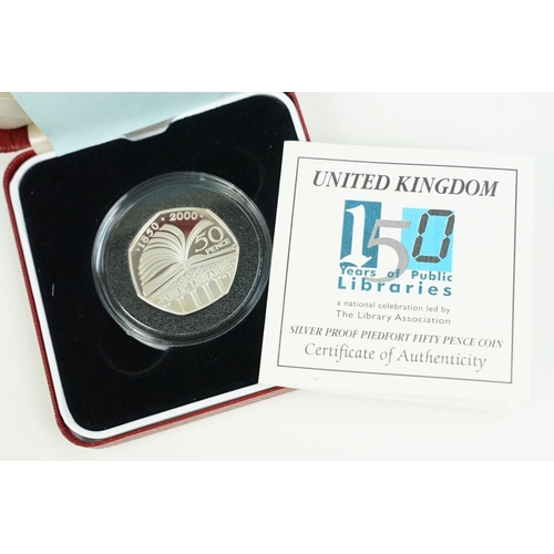 107 - A collection of four Royal Mint Queen Elizabeth II 50p silver proof coins to include 1997, 1993, 200... 