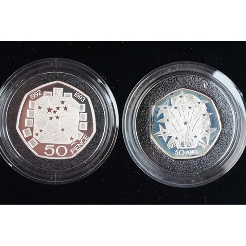 108 - A collection of four Royal Mint Queen Elizabeth II 50p silver proof coins to include 2003, 2 x 1992 ... 