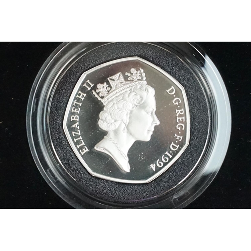 113 - A collection of three Royal Mint Queen Elizabeth II 50p silver proof coins to include 1994, 1998 and... 