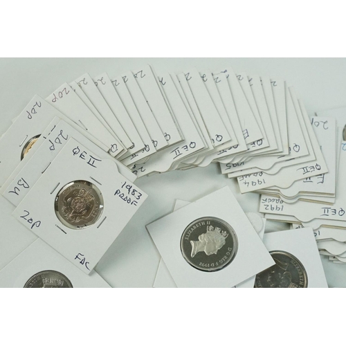 115 - A large collection of United Kingdom mainly uncirculated 10p and 20p coins within card coin sleeves.