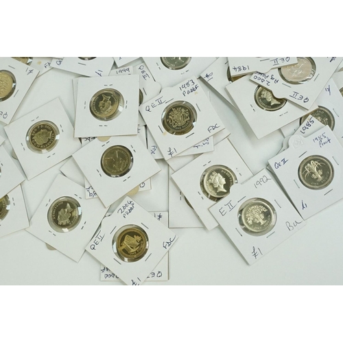 117 - A large collection of United Kingdom mainly uncirculated £1 coins within card coin sleeves.