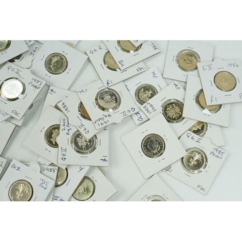 117 - A large collection of United Kingdom mainly uncirculated £1 coins within card coin sleeves.