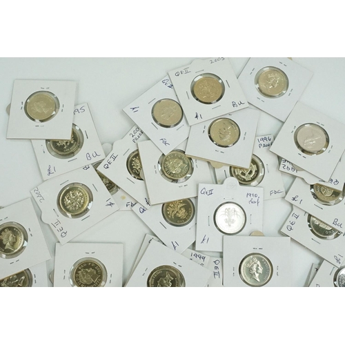 117 - A large collection of United Kingdom mainly uncirculated £1 coins within card coin sleeves.