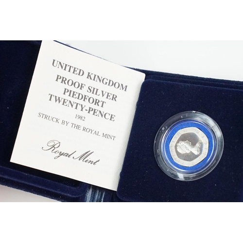 123 - A collection of Royal Mint United Kingdom silver proof coins to include £5, 5p, 10p and 20p examples... 