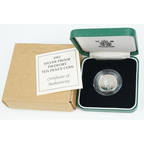 123 - A collection of Royal Mint United Kingdom silver proof coins to include £5, 5p, 10p and 20p examples... 