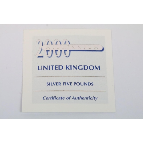 126 - A collection of four Royal Mint Queen Elizabeth II £5 silver proof coins to include 1993, 1997, 1996... 