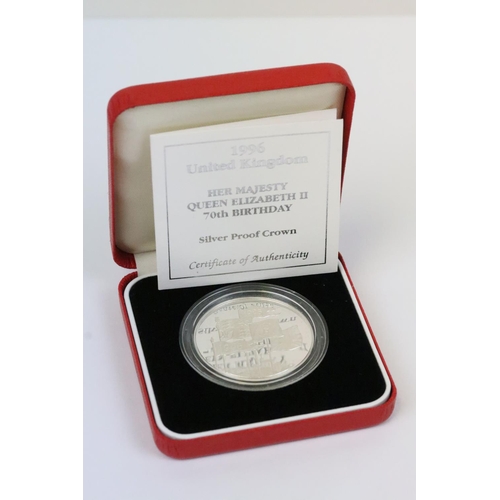 126 - A collection of four Royal Mint Queen Elizabeth II £5 silver proof coins to include 1993, 1997, 1996... 