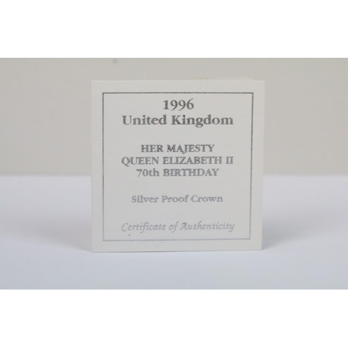 126 - A collection of four Royal Mint Queen Elizabeth II £5 silver proof coins to include 1993, 1997, 1996... 