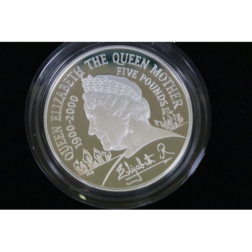 128 - A collection of four Royal Mint Queen Elizabeth II £5 silver proof coins to include 2003, 2000, 2001... 