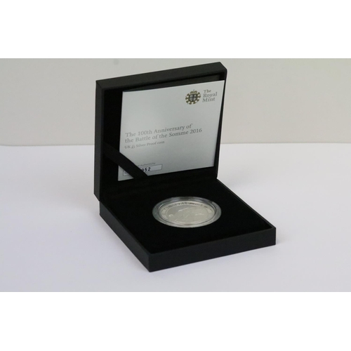 129 - A collection of four Royal Mint Queen Elizabeth II £5 silver proof coins to include 2005, 2016, 2002... 