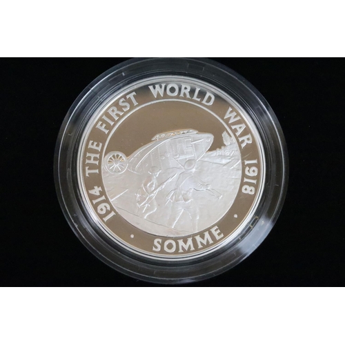 129 - A collection of four Royal Mint Queen Elizabeth II £5 silver proof coins to include 2005, 2016, 2002... 
