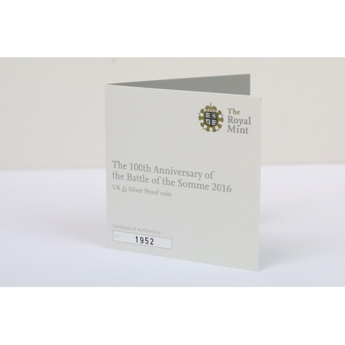129 - A collection of four Royal Mint Queen Elizabeth II £5 silver proof coins to include 2005, 2016, 2002... 