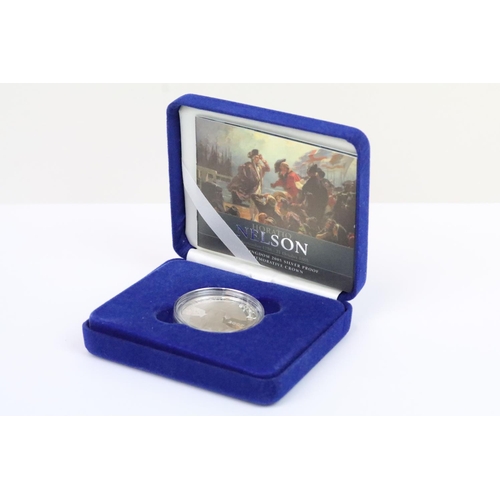 129 - A collection of four Royal Mint Queen Elizabeth II £5 silver proof coins to include 2005, 2016, 2002... 
