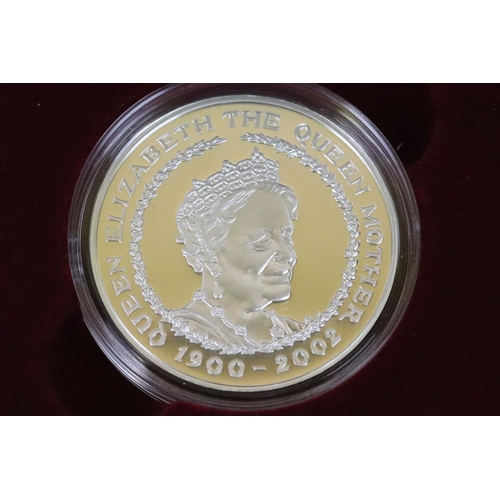 129 - A collection of four Royal Mint Queen Elizabeth II £5 silver proof coins to include 2005, 2016, 2002... 