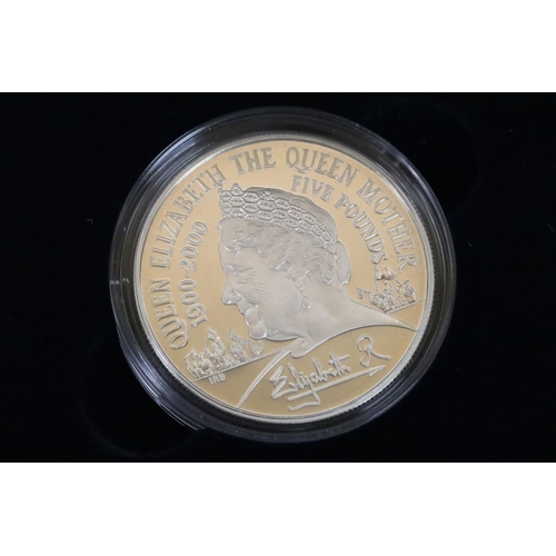 129 - A collection of four Royal Mint Queen Elizabeth II £5 silver proof coins to include 2005, 2016, 2002... 