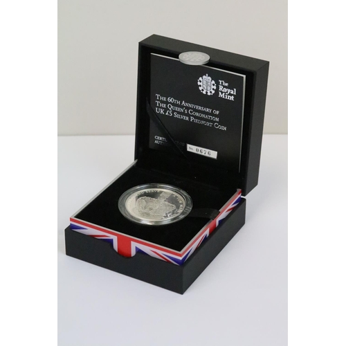 134 - A collection of four Royal Mint Queen Elizabeth II £5 silver proof coins to include 2015, 2014, 2013... 