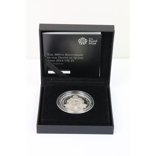 134 - A collection of four Royal Mint Queen Elizabeth II £5 silver proof coins to include 2015, 2014, 2013... 