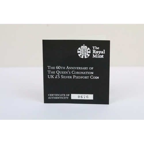 134 - A collection of four Royal Mint Queen Elizabeth II £5 silver proof coins to include 2015, 2014, 2013... 