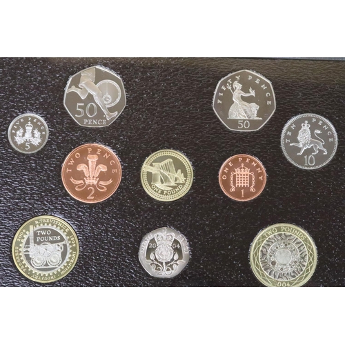 174 - A collection of seven Royal Mint Queen Elizabeth II United Kingdom coin year sets to include 2004, 2... 