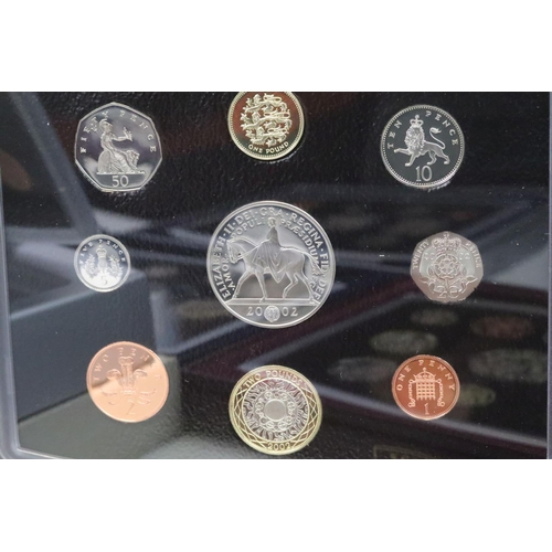 174 - A collection of seven Royal Mint Queen Elizabeth II United Kingdom coin year sets to include 2004, 2... 