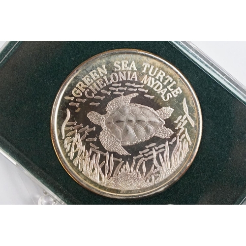 184 - An Ascension silver proof medallion featuring a green sea turtle.