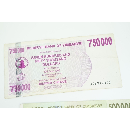 185 - A collection of high inflation Zimbabwe banknotes of various denominations.