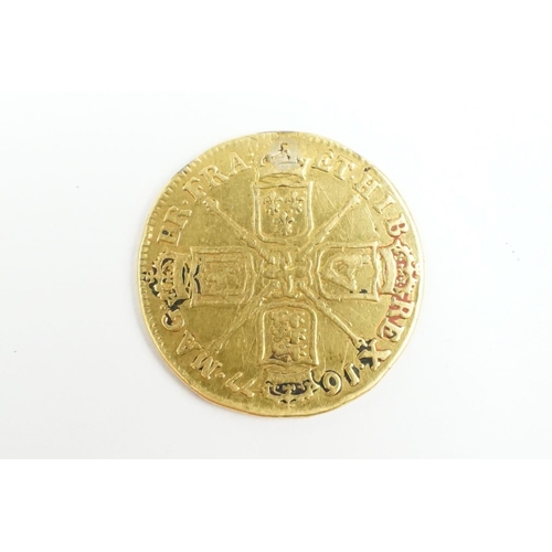 194 - A British King Charles II 1677 gold full guinea coin.