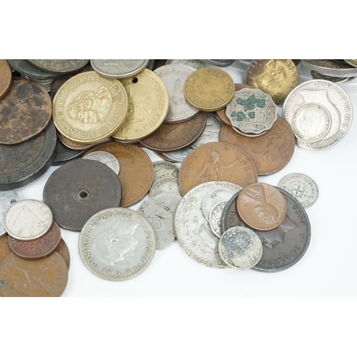 195 - A collection of British pre decimal and World coins to include a selection of silver examples and to... 