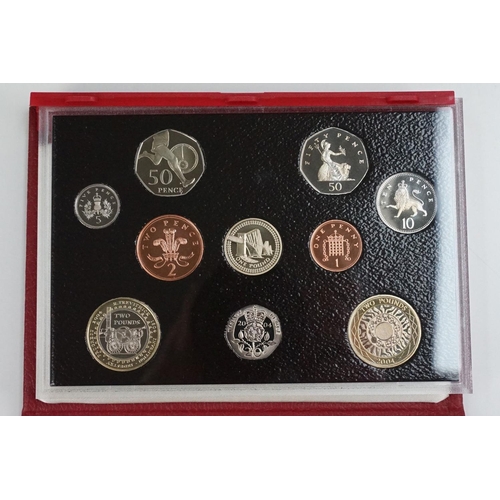 202 - A collection of four Royal Mint United Kingdom Queen Elizabeth II annual proof coin sets to include ... 